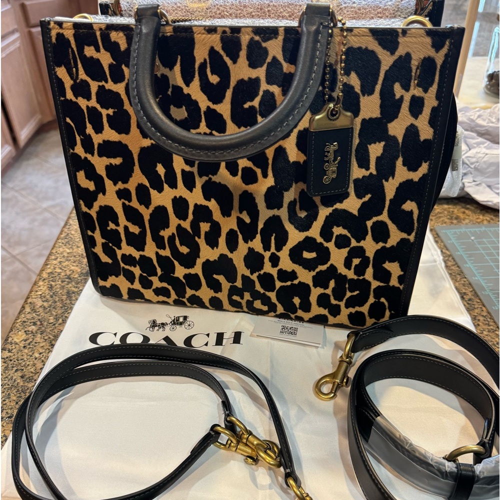 Brand new rogue coach leopard authentic 100%